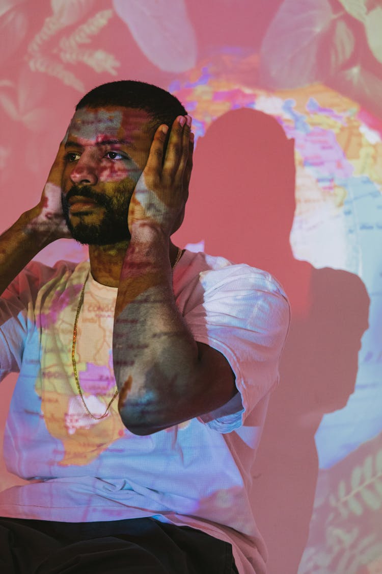 Projection Photography Of A Man Covering His Ears