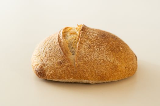 A delicious artisan bread loaf with a golden crust, perfect for breakfast or snacking.