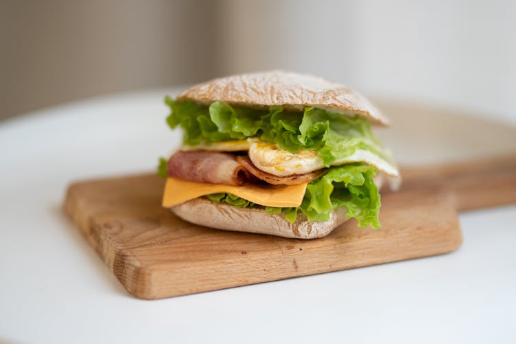 White Sandwich On Brown Wooden Board