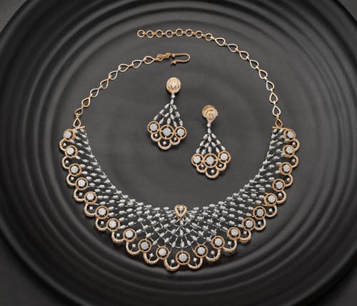 Luxurious Diamond Necklace and Earings on Black Surface