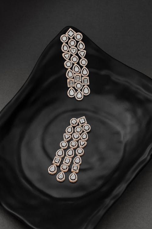 Luxurious Diamond Earing on Black Surface