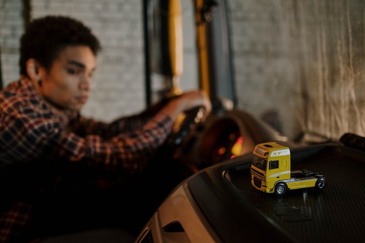 Yellow Miniature Toy Truck On Black Surface