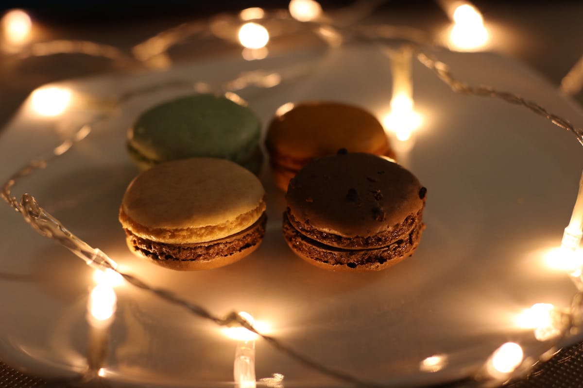 Four Assorted Macaroons on Plate