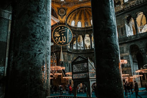 Interior of aged mosque with columns and rich decorated walls