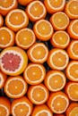 Fresh juicy oranges and grapefruit served on table