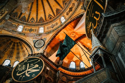 Free From below of aged ornamental dome with arched windows in Hagia Sophia Mosque in Istanbul Stock Photo