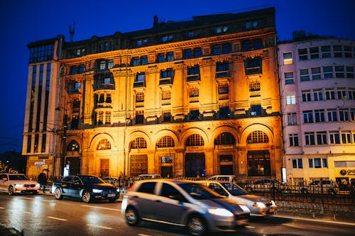 Free Facade of modern building in evening near road Stock Photo