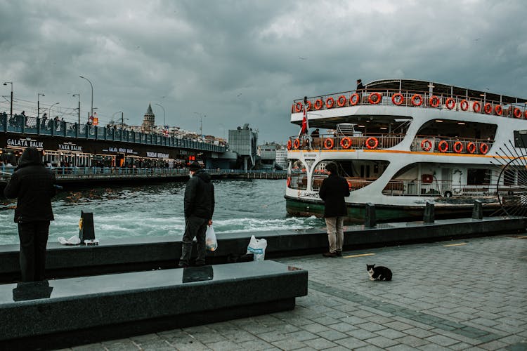 Ship Floating In City In Cloudy Day