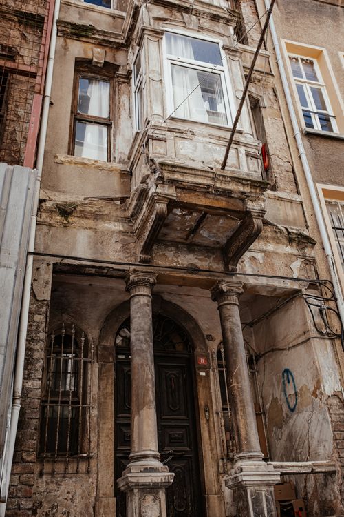 Free From below of aged concrete house exterior with shabby walls and ornamental elements Stock Photo