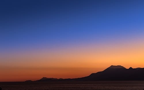 Free Silhouette of Mountain during Dawn  Stock Photo