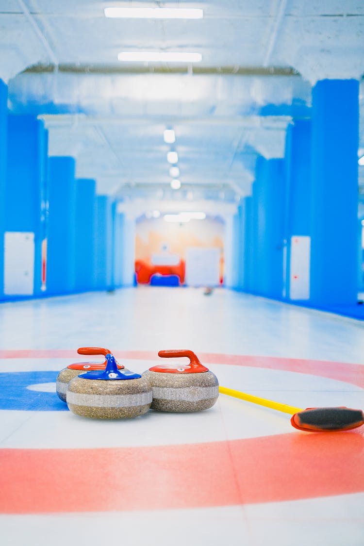 Curling Sheet With Stones And Broom