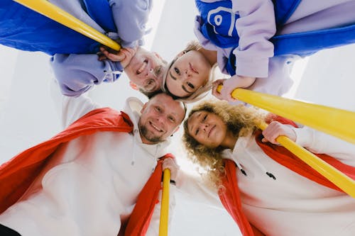 Glad sportsmen in group embrace during curling game