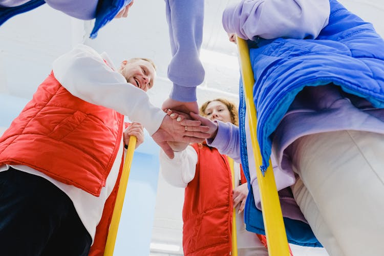 Curling Team Joining Palms Together