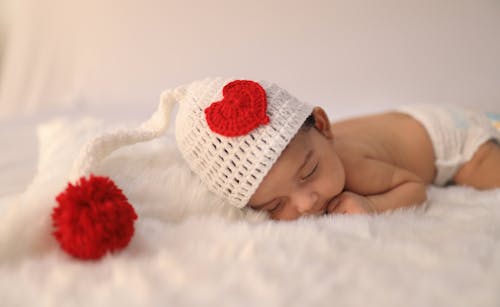 Free Photo of a Newborn Wearing a Knitted Hat Stock Photo