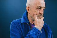 Serious senior man touching chin