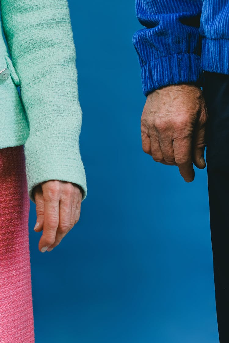 Hands Of Elderly Man And Woman 