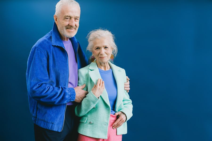 Stylish mature couple standing confidently together