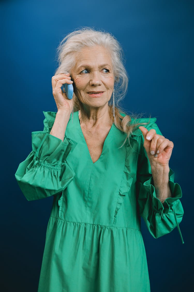 An Elderly Woman Talking On The Phone