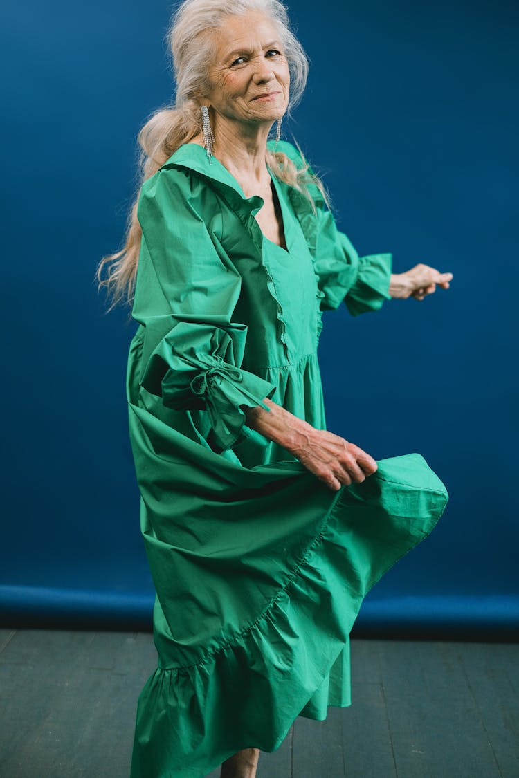 Elderly Woman In Green Dress Dancing