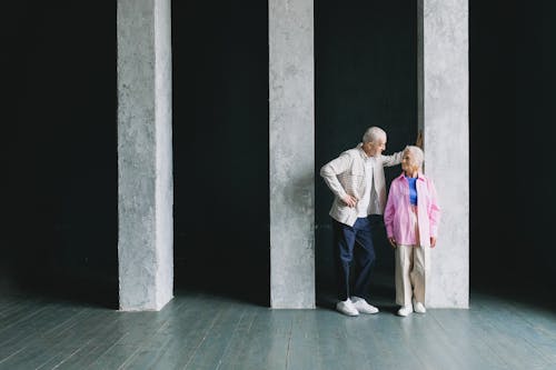 Elderly Couple next to Columns