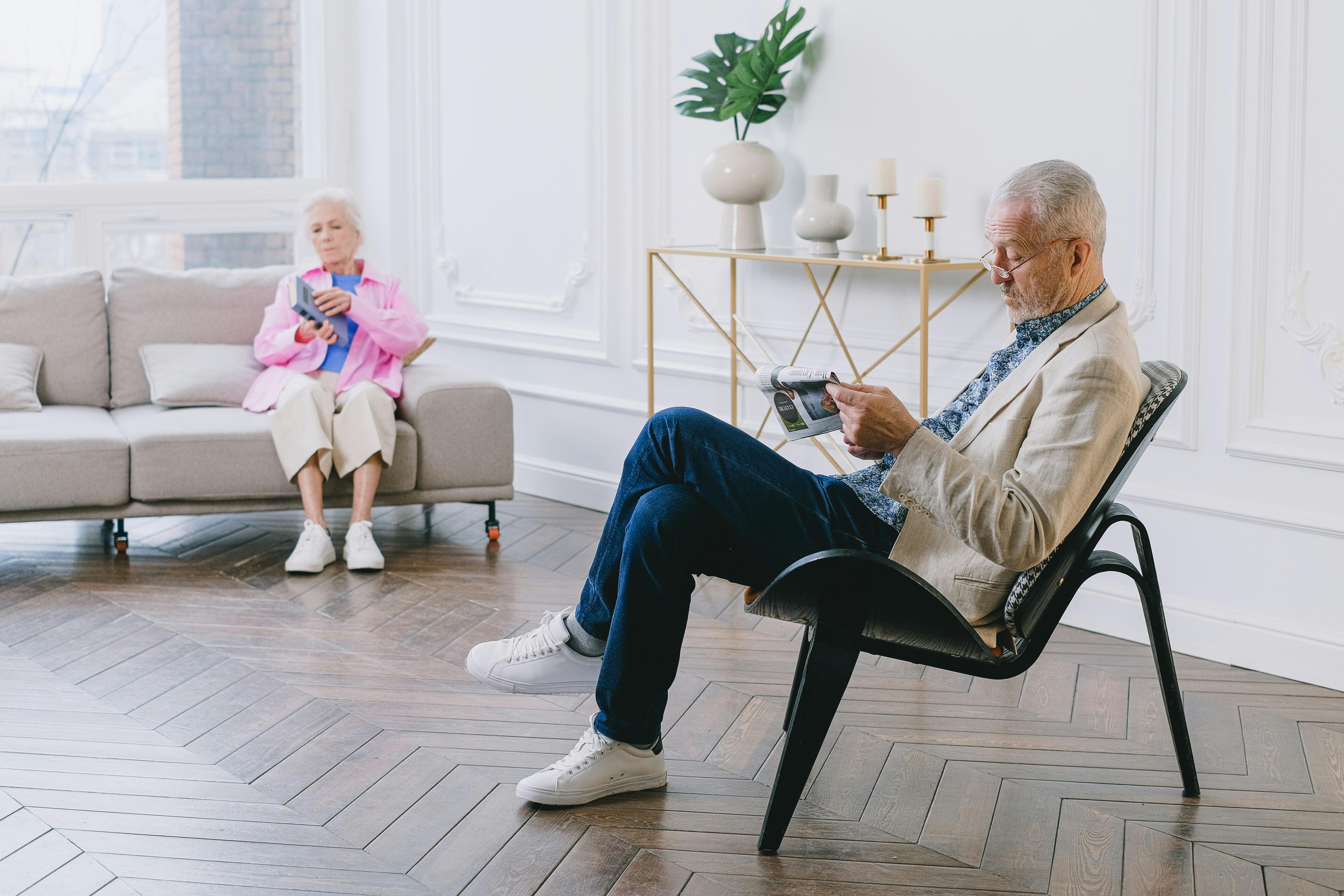Older adult standing up from a chair at home