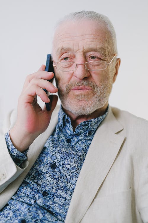 Portrait of an Elderly Man Talking on the Phone