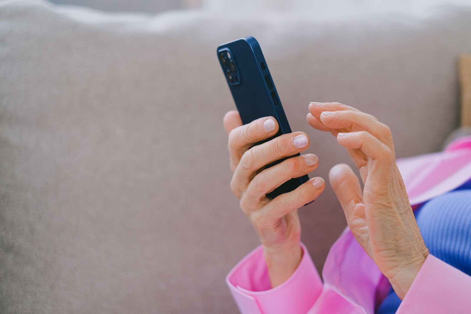 Close-up of a person's hands using a smartphone