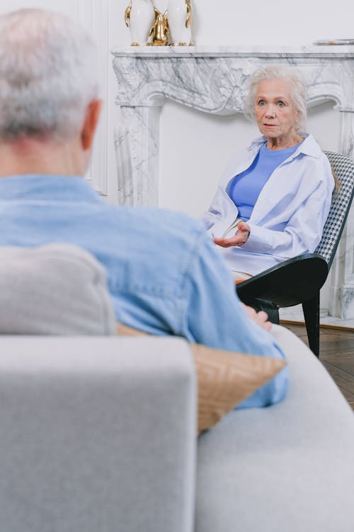 An Elderly Woman with Gray Hair Talking