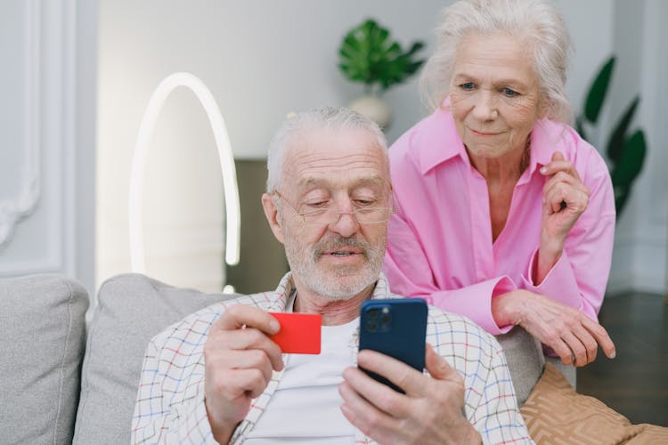 An Elderly Couple Making An Online Transaction