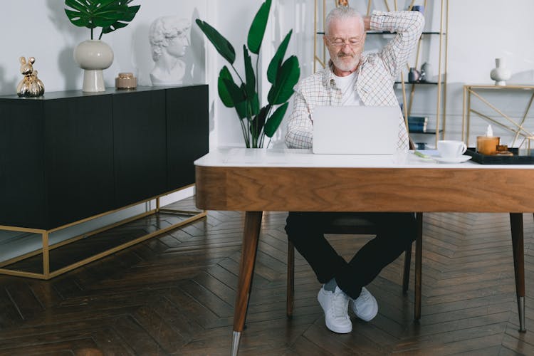 Man Sitting At His Desk