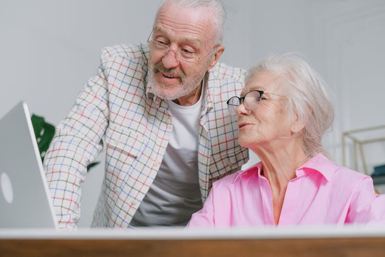 Photo Of An Elderly Couple With Eyeglasses Talking