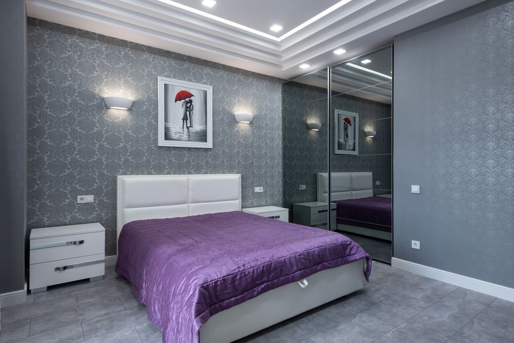 Staged bedroom with warm accent wall