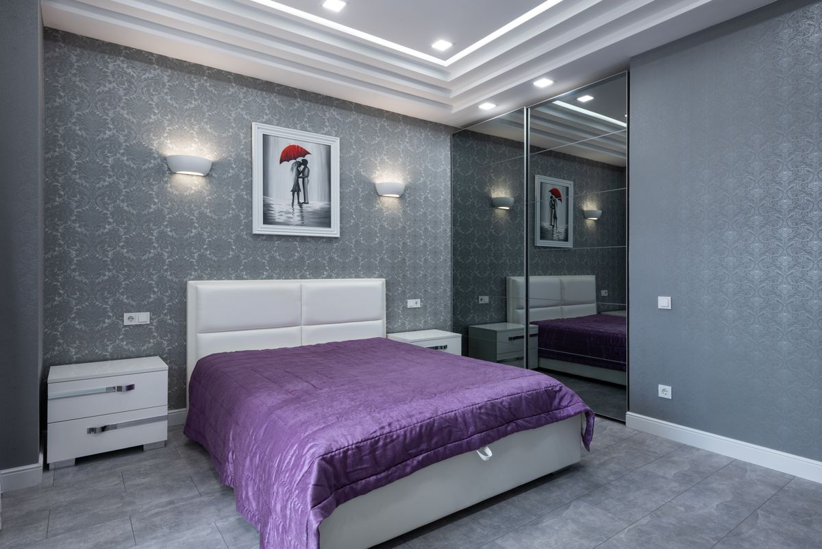Staged bedroom with warm accent wall