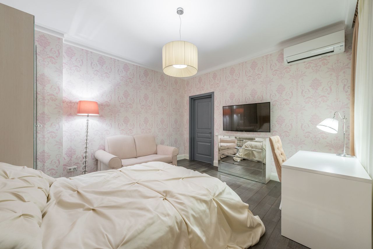 interior of stylish bedroom with comfortable bed and light furniture i