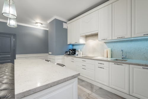 A White Kitchen Cabinets With Sink