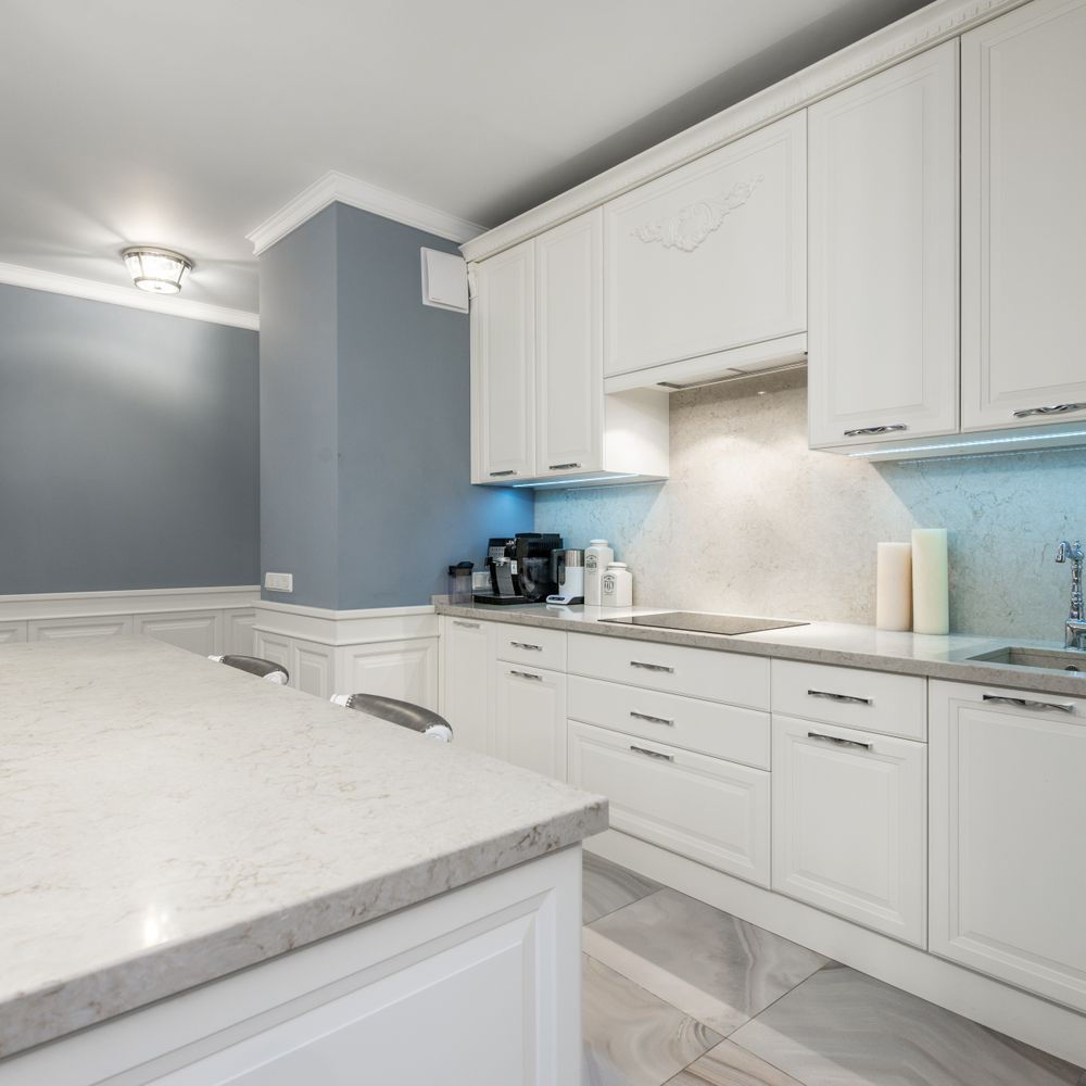 Kitchen Spraying in Tottenham Hale — careful masking before painting begins