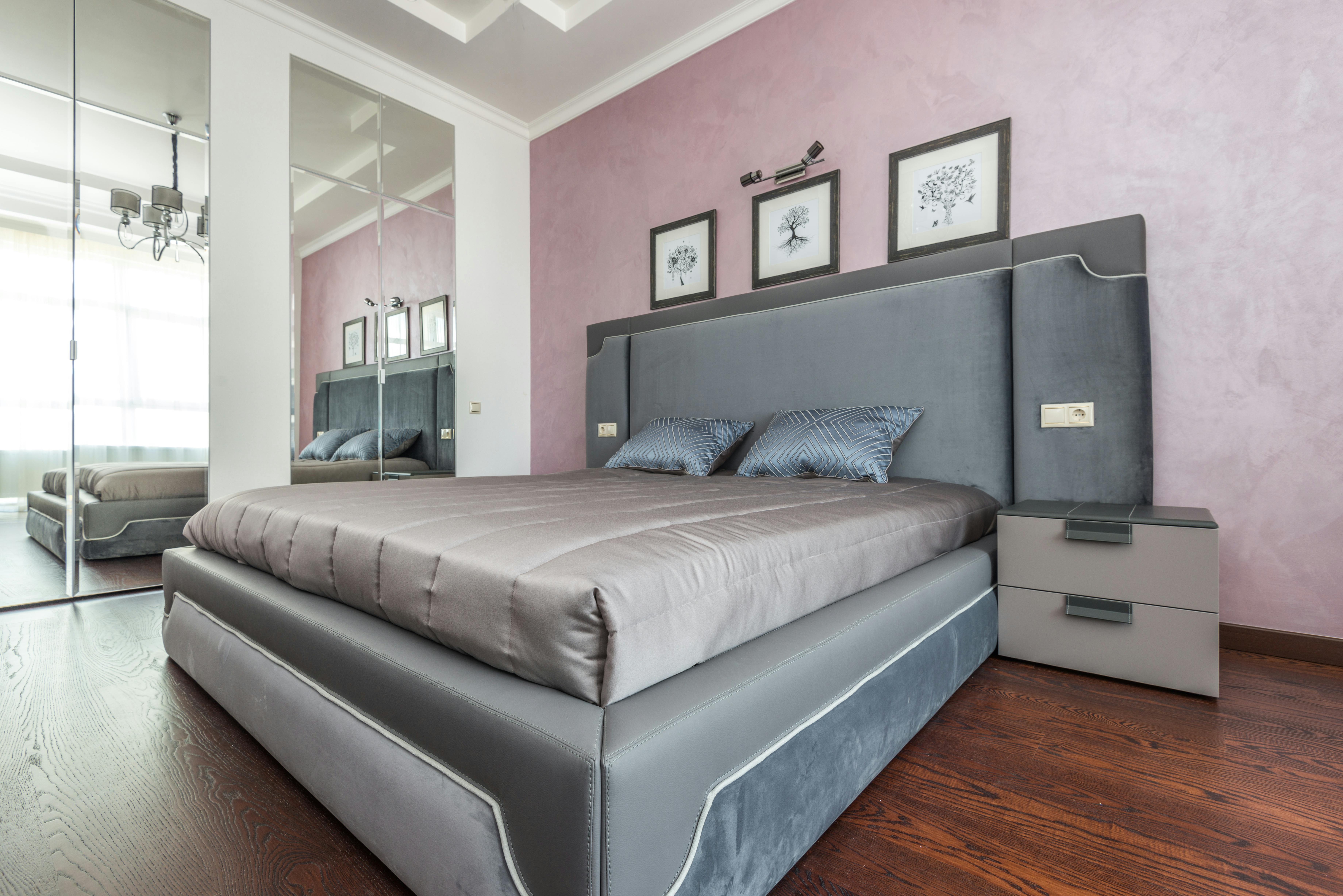 Stylish modern bedroom featuring elegant decor, soft lighting, and a chic design.