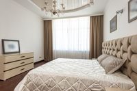 Staged luxury bedroom with warm lighting