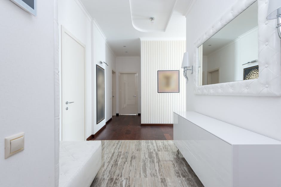 A small, bright apartment hallway painted in a light, space-enhancing color, with minimal decor to emphasize openness. - apartment unit paint color A small, bright apartment hallway painted in a light, space-enhancing color, with minimal decor to emphasize openness. - apartment unit paint color