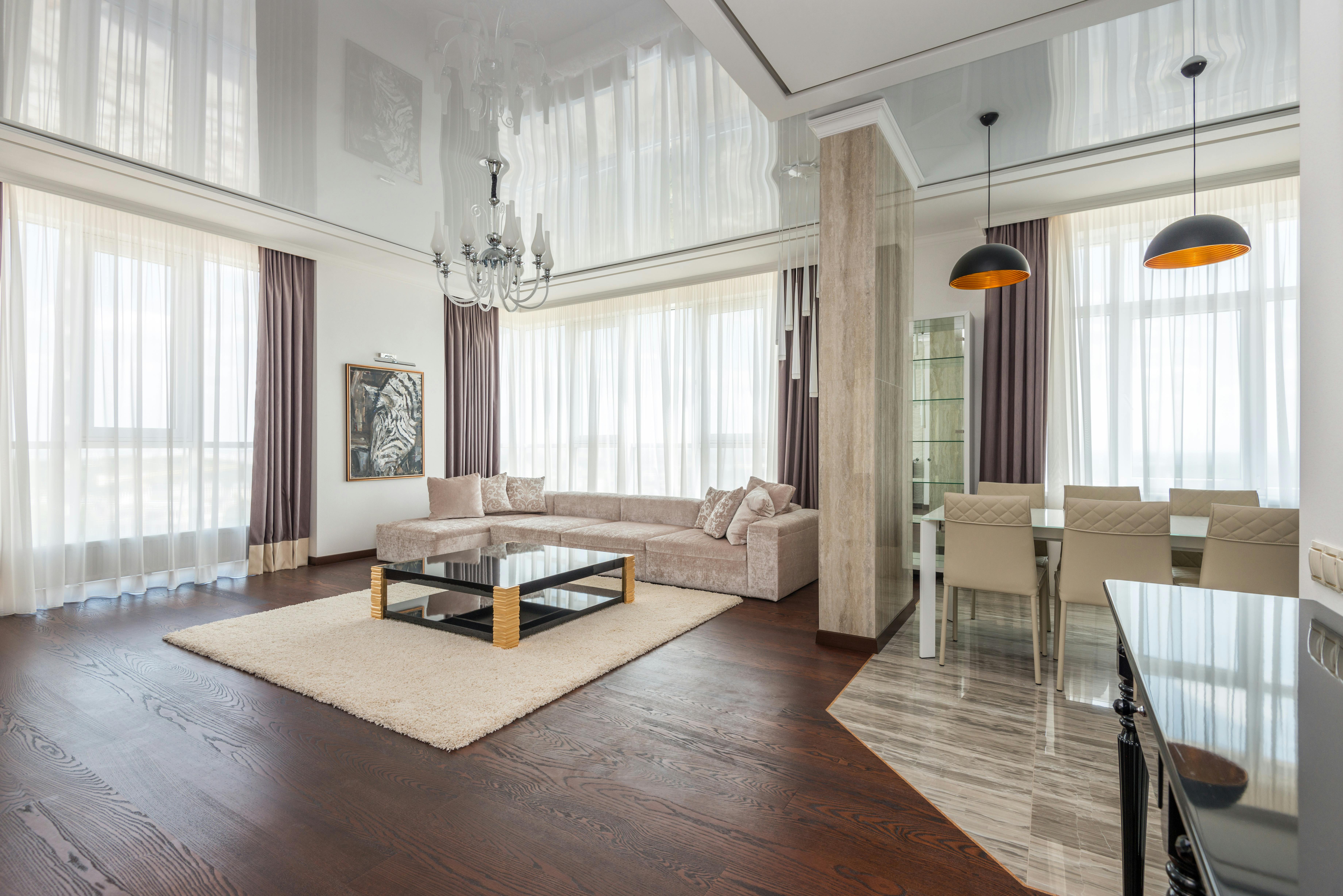 Large Pendant Light Or Chandelier In A Small Living Room Setting