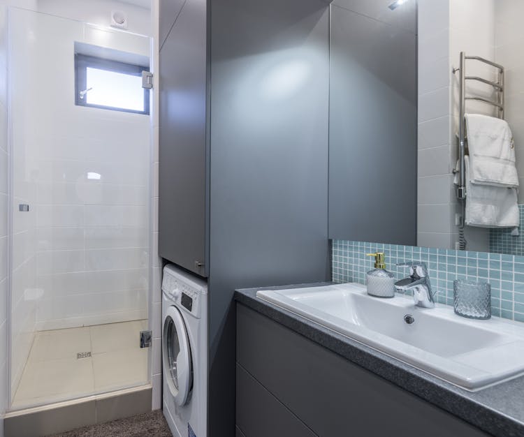 Bathroom With Washing Machine In An Apartment For Rent