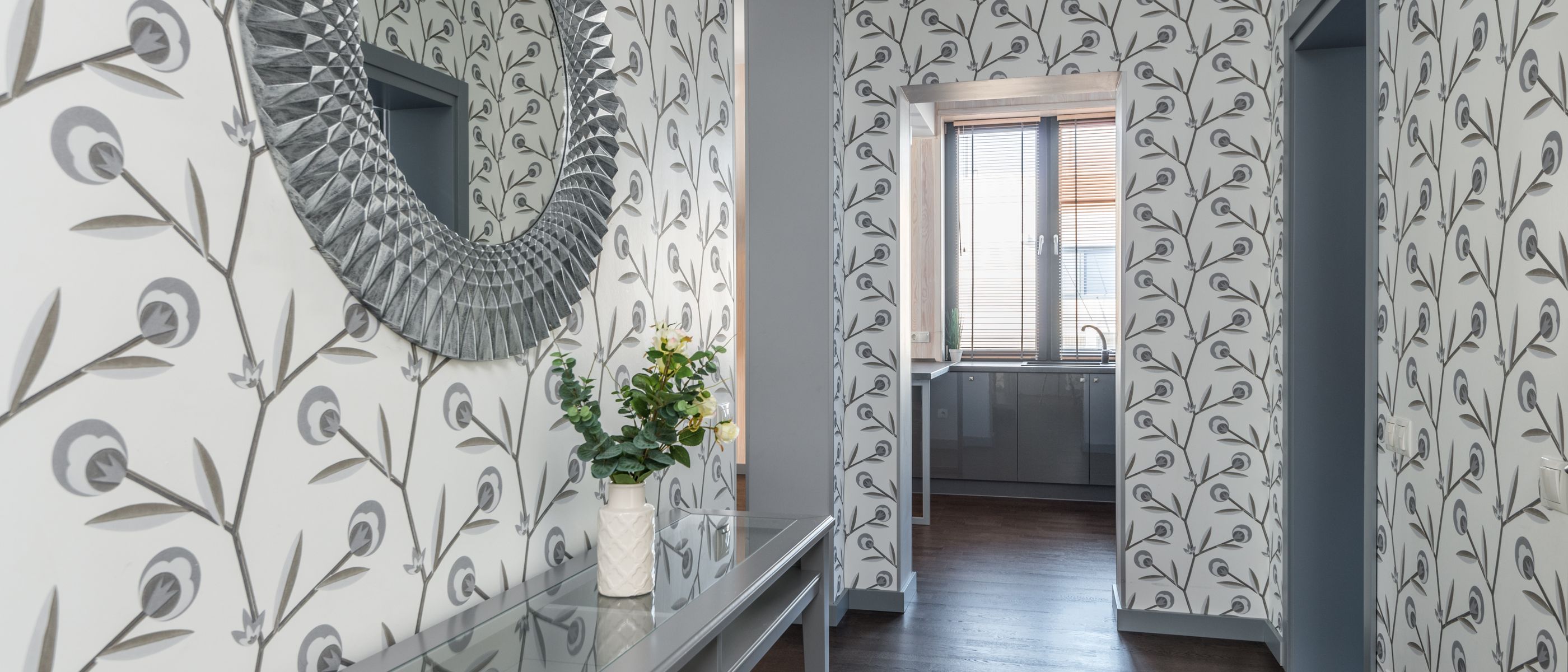 Wallpapering in Kevington — a decorator at work mid-project