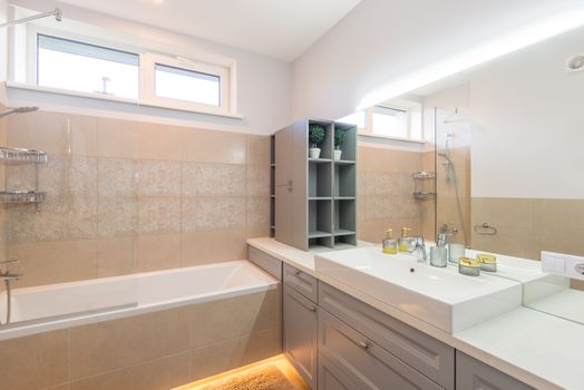 Elegant minimalist bathroom with a bathtub and dual sink reflecting modern interior design.