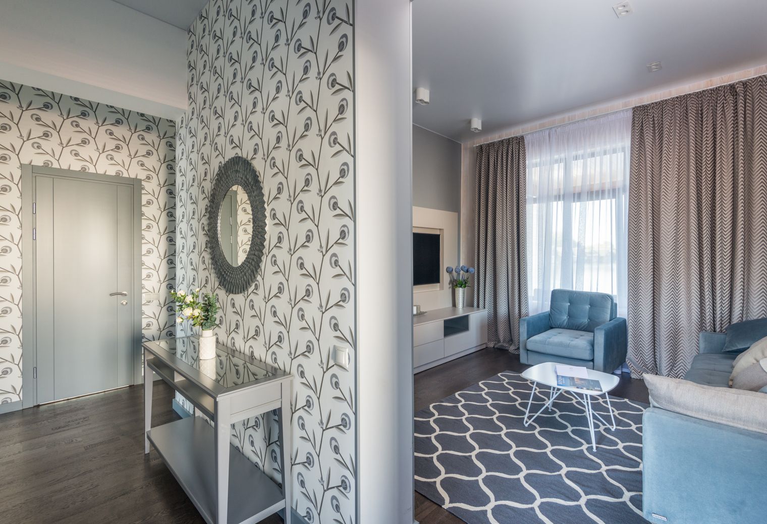 Wallpapering in Tottenham Green — a decorator at work mid-project