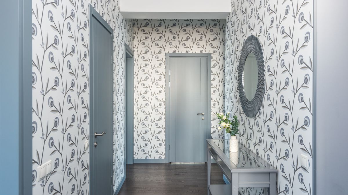 A hallway papered in a floral pattern. Patterned papers need every strip to start at the same point in the repeat.