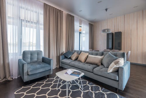 Free Modern Living Room Area with Big Windows Stock Photo