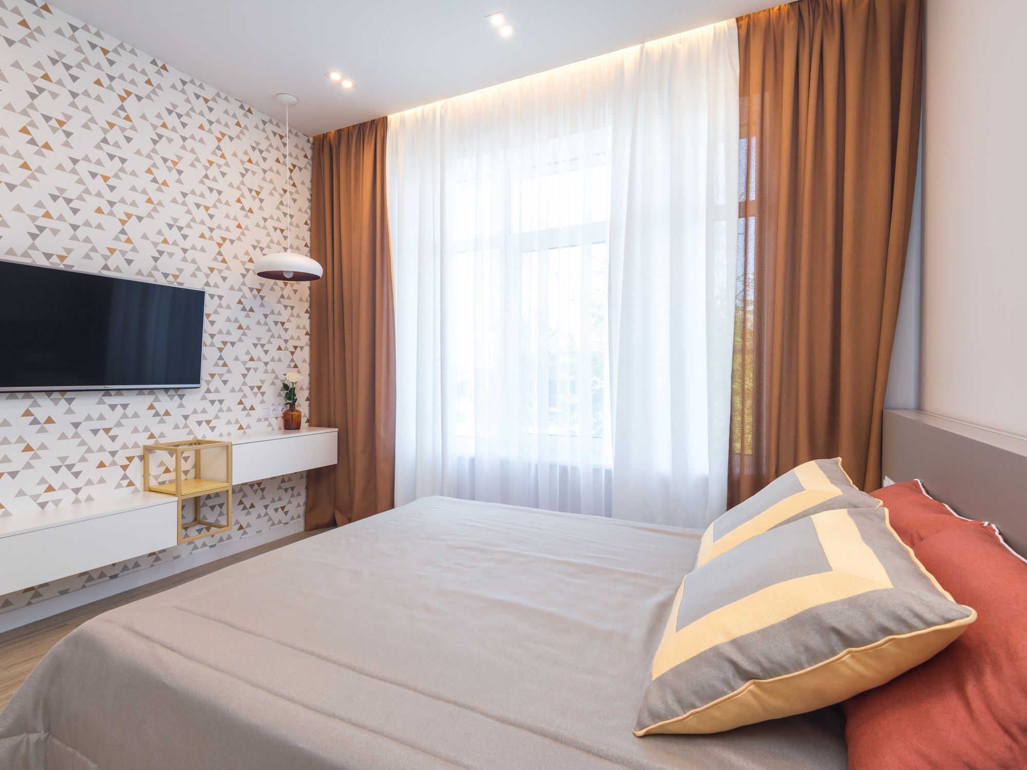 Interior Painting in Plaistow, Newham — decorator applying interior paint to walls and ceilings