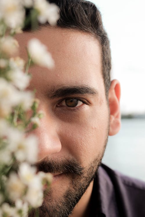 Selective Focus Photo of a Man with Facial Hair and a Brown Eye