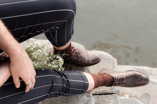 A Person Wearing Brown Leather Shoes