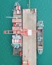 A Cargo Ship Containers Docked on a Pier